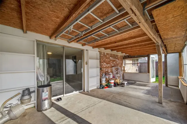 a view of a porch with wooden floor