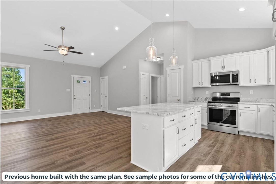 2638 West Creek Road Crewe, VA 23930 - Photo 8 of 29 a kitchen with stainless steel appliances a stove top oven a sink a refrigerator and a window