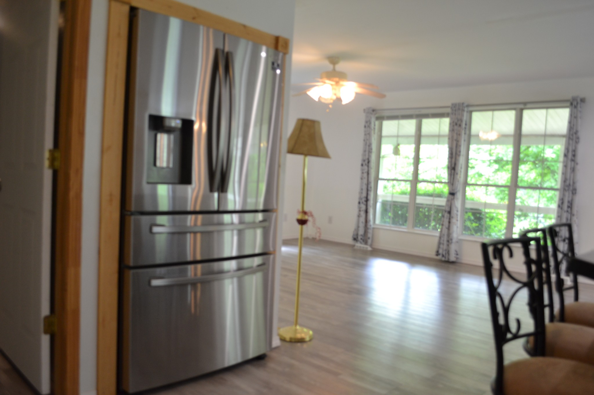 1505 Add Stafford Road Hilham, TN 38568 - Photo 25 of 65 a kitchen with stainless steel appliances granite countertop a refrigerator a stove and a wooden floors