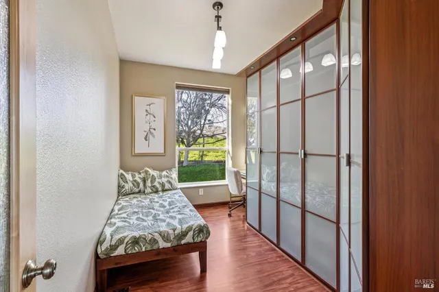 a bedroom with furniture and a window