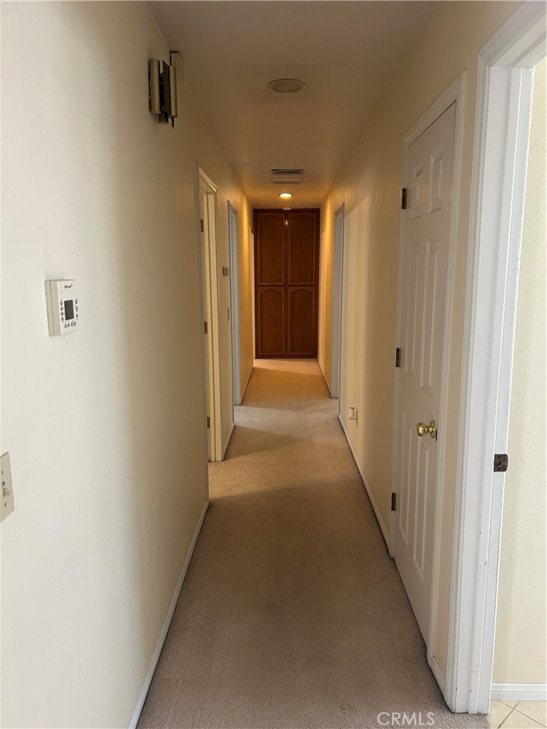 20187 Itasca Road Apple Valley, CA 92308 - Photo 7 of 35 a view of a hallway with wooden floor