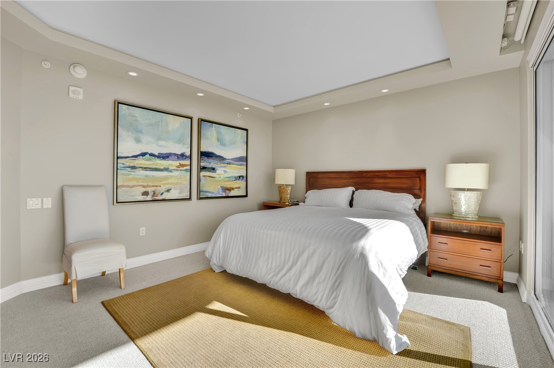 2777 Paradise Road, Unit 1803 Las Vegas, NV 89109 - Photo 29 of 48 Carpeted bedroom featuring recessed lighting and a tray ceiling