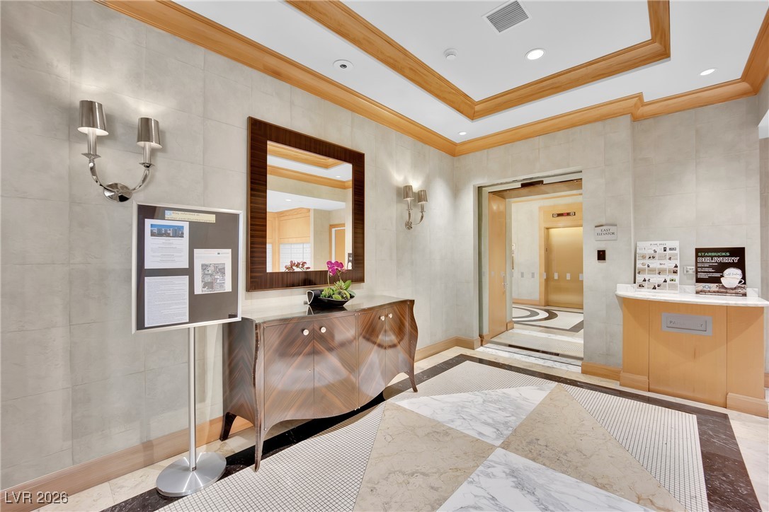 2777 Paradise Road, Unit 1803 Las Vegas, NV 89109 - Photo 44 of 48 Reception with ornamental molding, tile walls, and recessed lighting