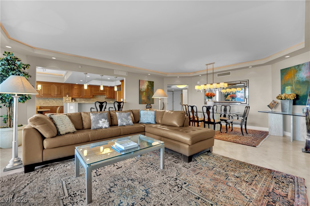 2777 Paradise Road, Unit 1803 Las Vegas, NV 89109 - Photo 6 of 48 Living area featuring a raised ceiling and recessed lighting