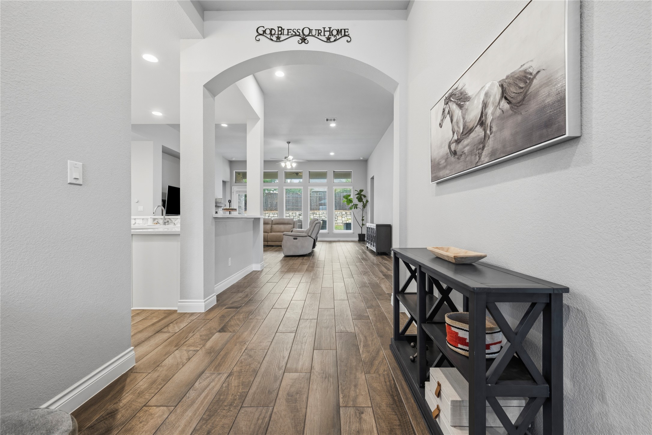 140 Catani Loop Georgetown, TX 78628 - Photo 8 of 36 Step into a generously proportioned interior showcasing a vaulted ceiling and rich hardwood flooring.