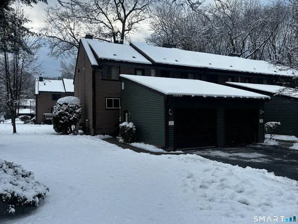 a view of a car park in front of house