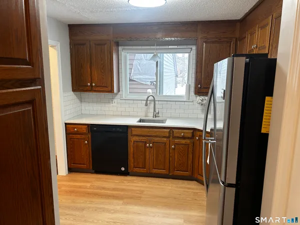 a view of a kitchen from the hallway