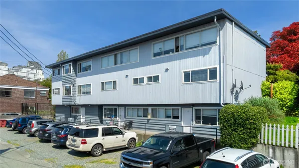 a front view of a house with parking space