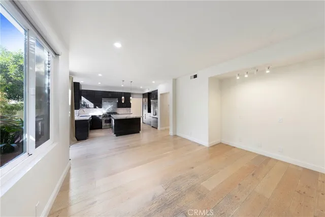 a view of a kitchen with furniture and a window