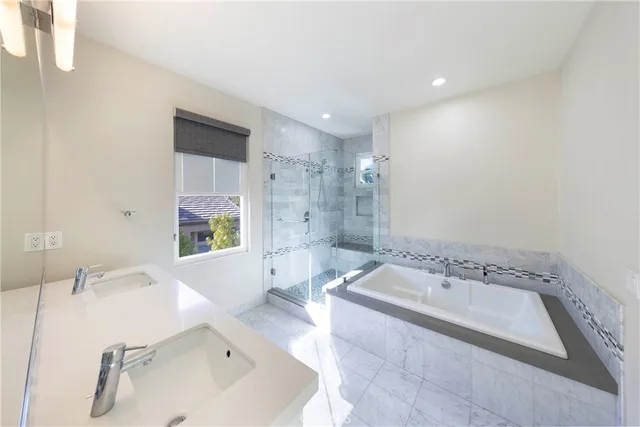 a bathroom with a bathtub and a sink