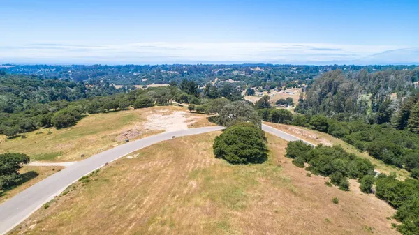 a view of a swimming pool with an outdoor seating