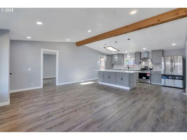 a view of kitchen with wooden floor