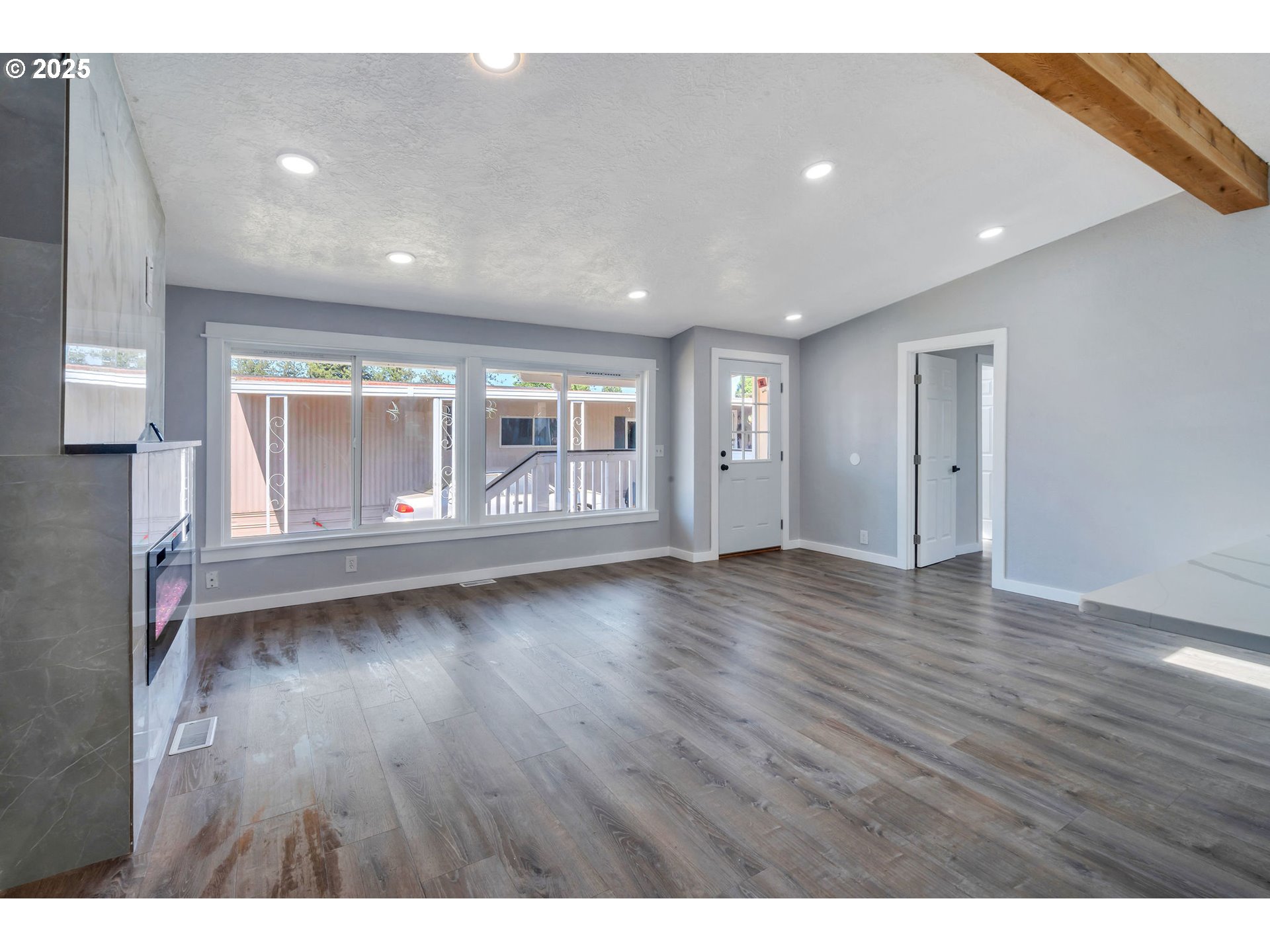3554 Turner Road Southeast Salem, OR 97302 - Photo 10 of 26 a view of an empty room with wooden floor and fan