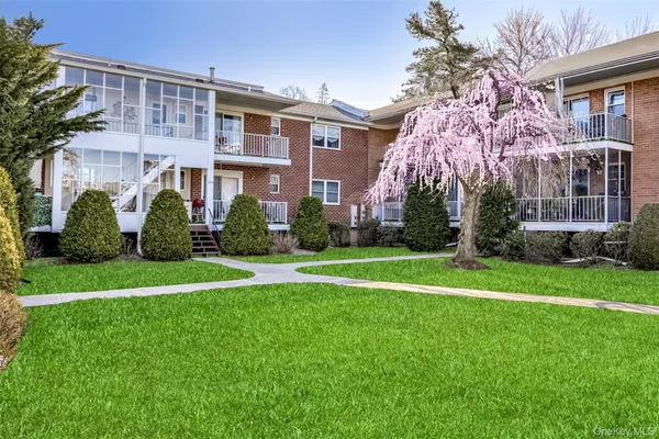 a view of a building with a yard
