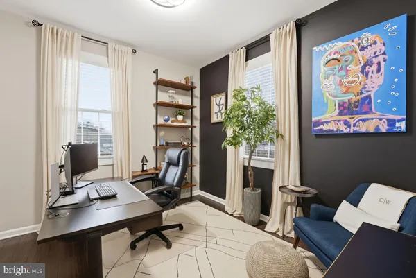 a view of entryway livingroom and hall with wooden floor
