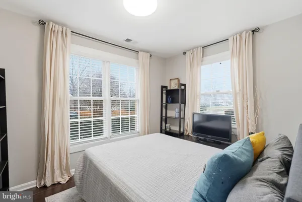 a bedroom with a bed and furniture