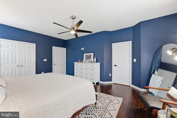 a dining room with furniture and a chandelier
