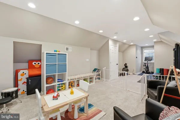 a bathroom with a tub sink shower and mirror