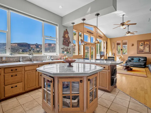a kitchen with stainless steel appliances granite countertop a sink and cabinets