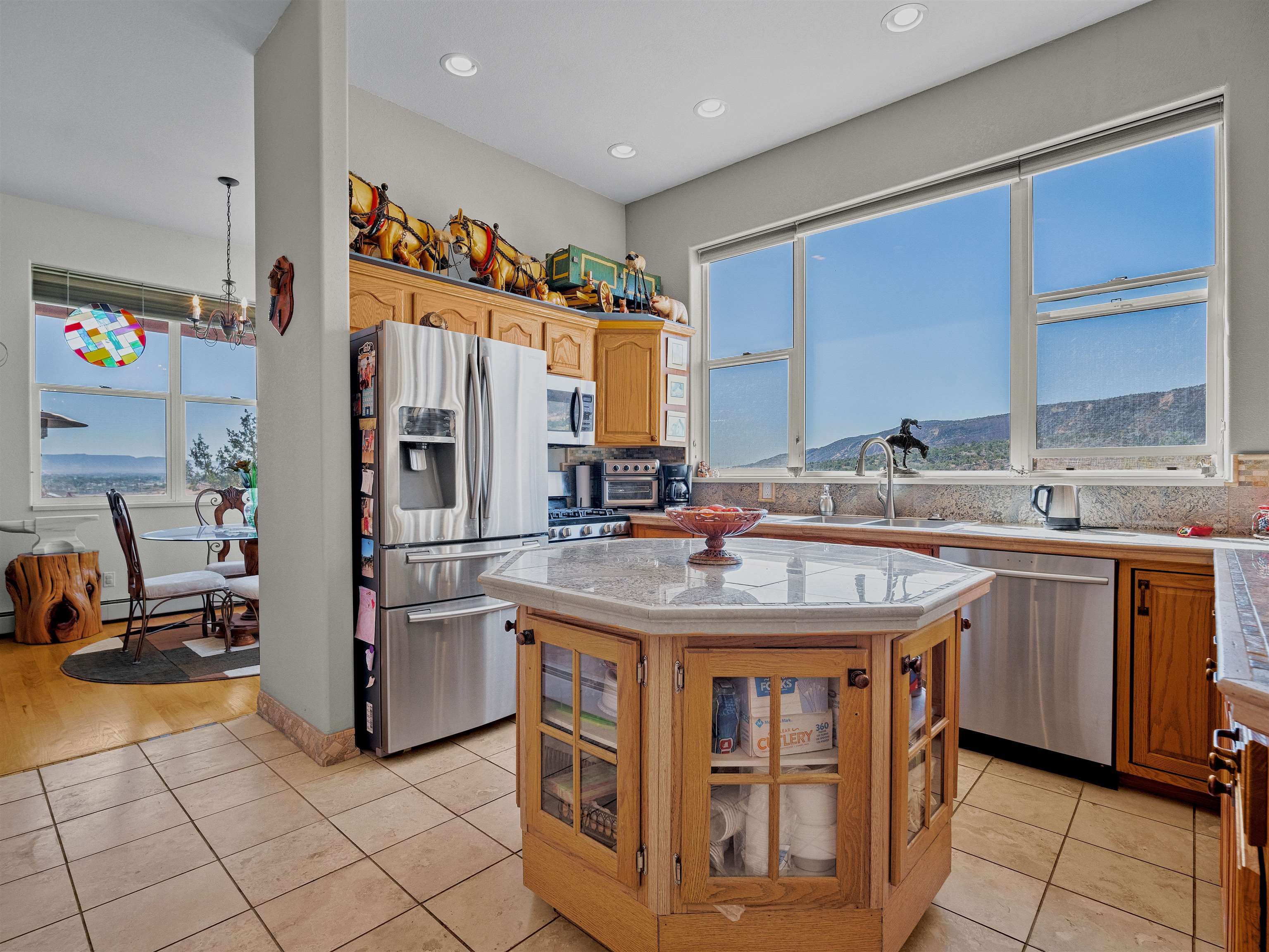 945 Prince Court Fruita, CO 81521 - Photo 12 of 38 a kitchen with stainless steel appliances granite countertop a sink and a refrigerator