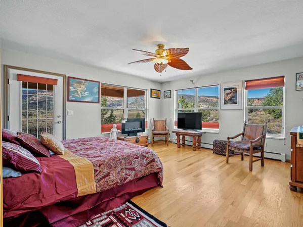 a bedroom with a bed and a chair