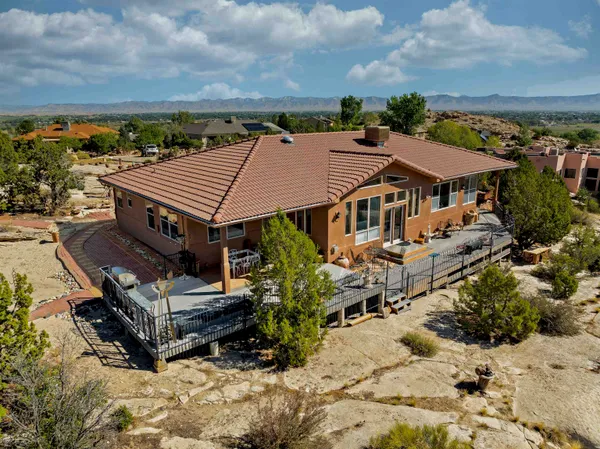an aerial view of a house with roof deck outdoor space and city view