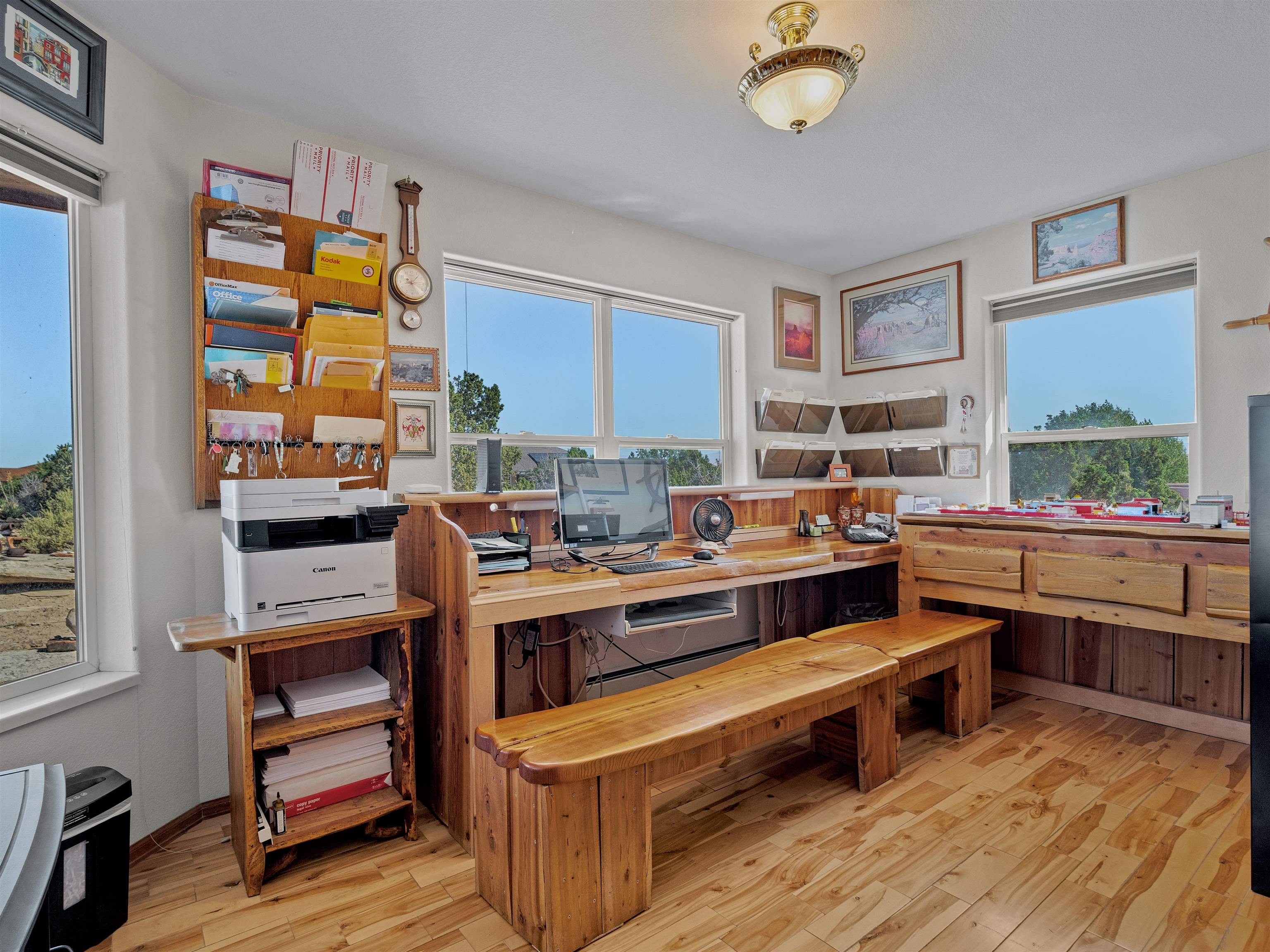 945 Prince Court Fruita, CO 81521 - Photo 24 of 38 a view of a room with kitchen island stainless steel appliances wooden floor and window