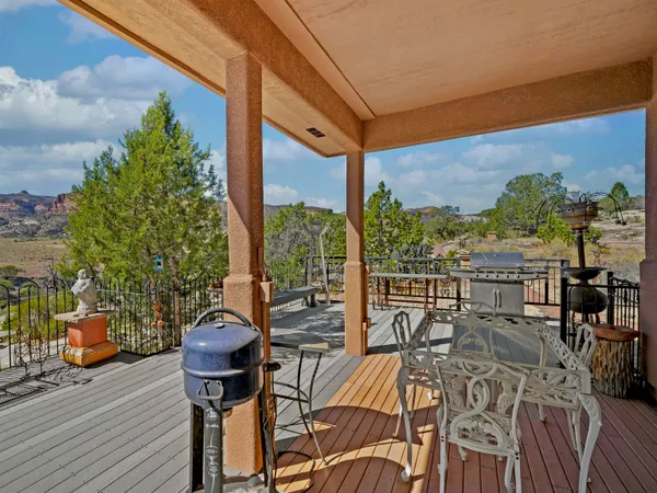 a view of a balcony with wooden floor