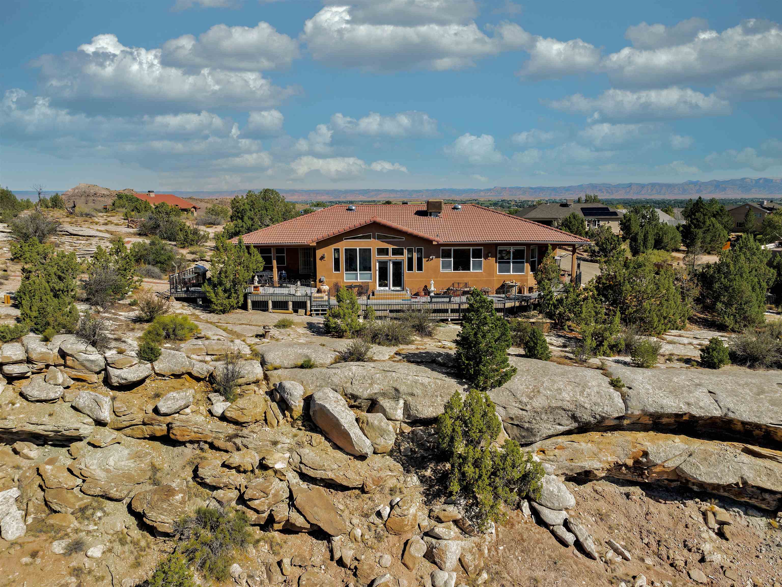 945 Prince Court Fruita, CO 81521 - Photo 4 of 38 a view of a lake with a lot of houses