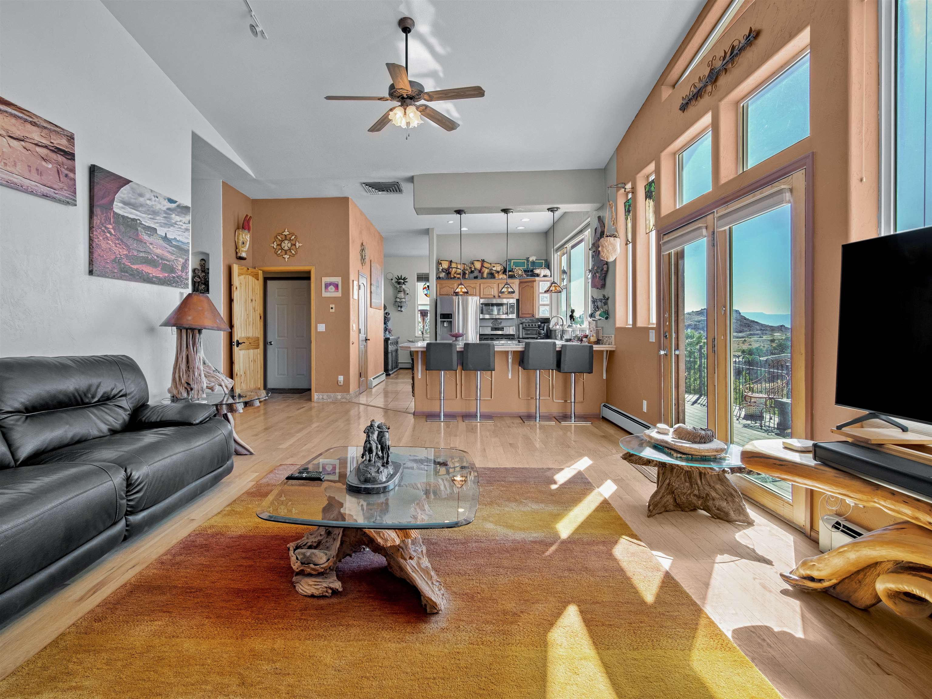945 Prince Court Fruita, CO 81521 - Photo 7 of 38 a living room with patio furniture and a flat screen tv