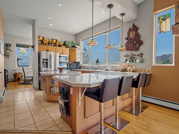 a dining hall with a dining table and chairs