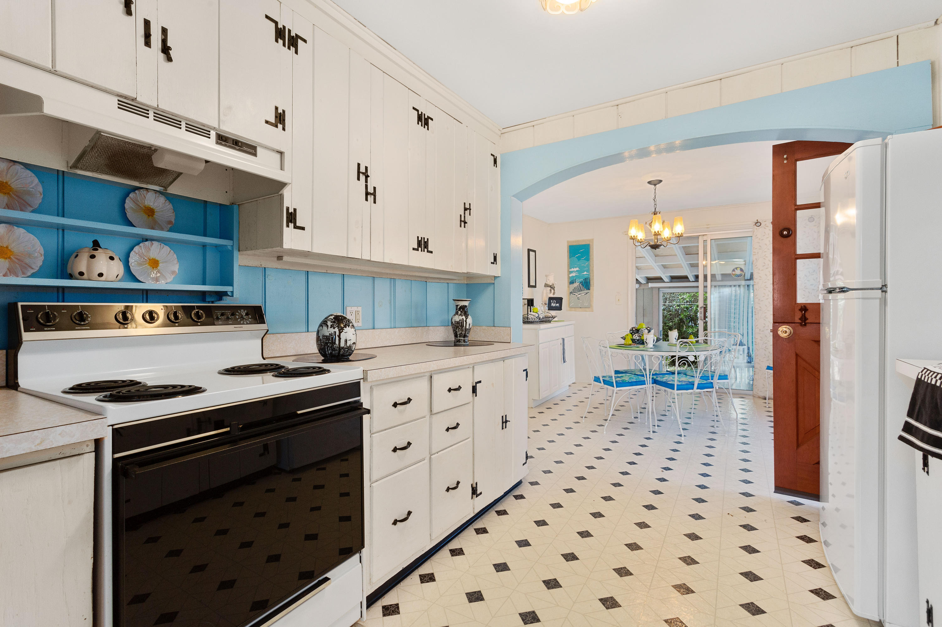 69 George Street Barnstable, MA 02630 - Photo 11 of 32 a kitchen with granite countertop a stove a sink and a refrigerator