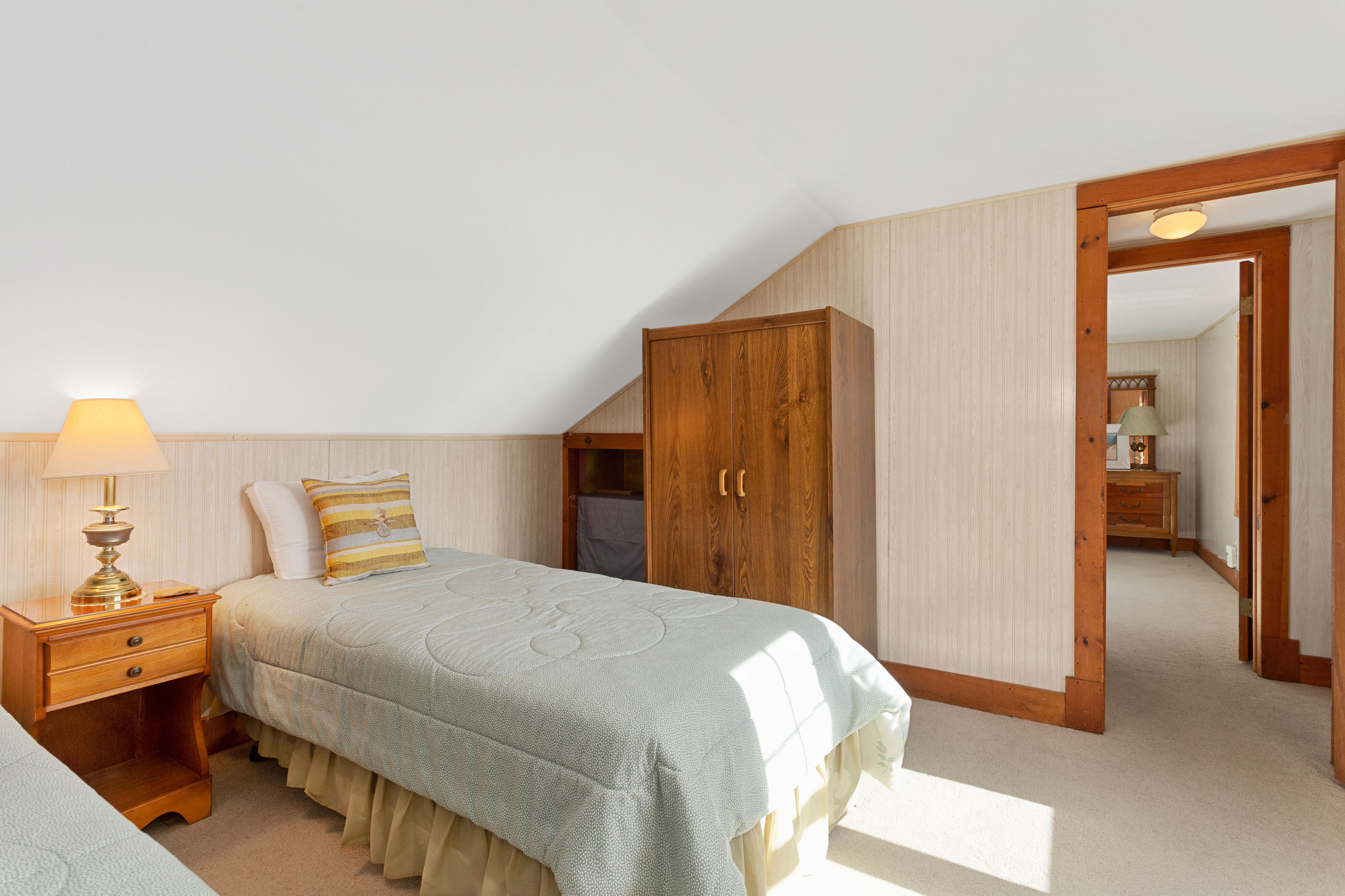 69 George Street Barnstable, MA 02630 - Photo 25 of 32 a bedroom with a bed and a lamp