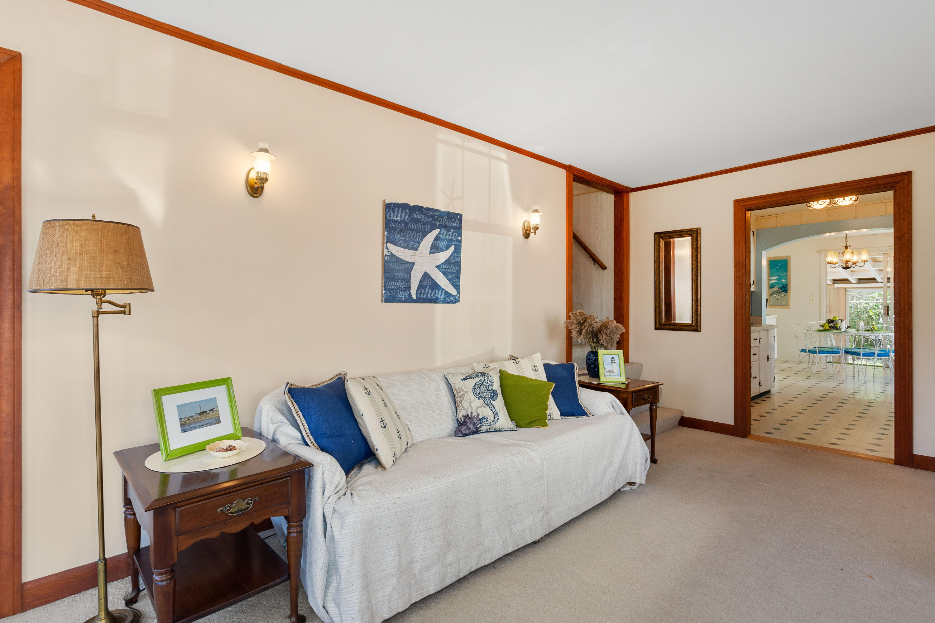 69 George Street Barnstable, MA 02630 - Photo 7 of 32 a living room with furniture and a lamp
