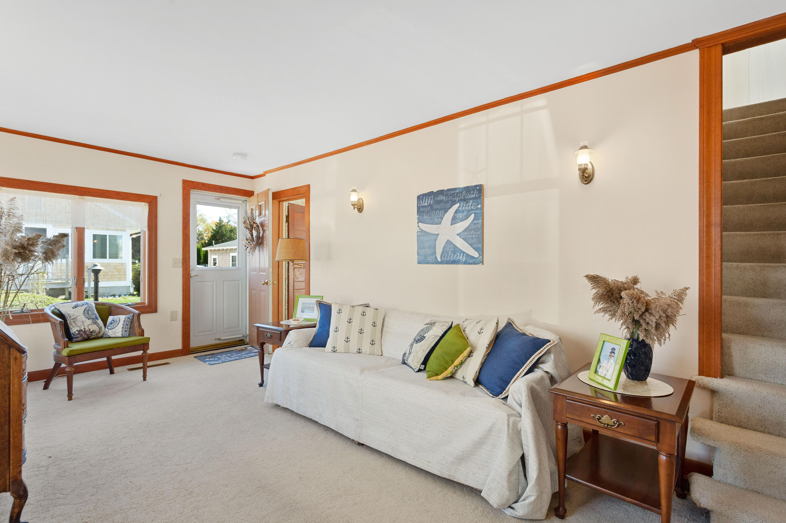 69 George Street Barnstable, MA 02630 - Photo 8 of 32 a living room with furniture and a large window