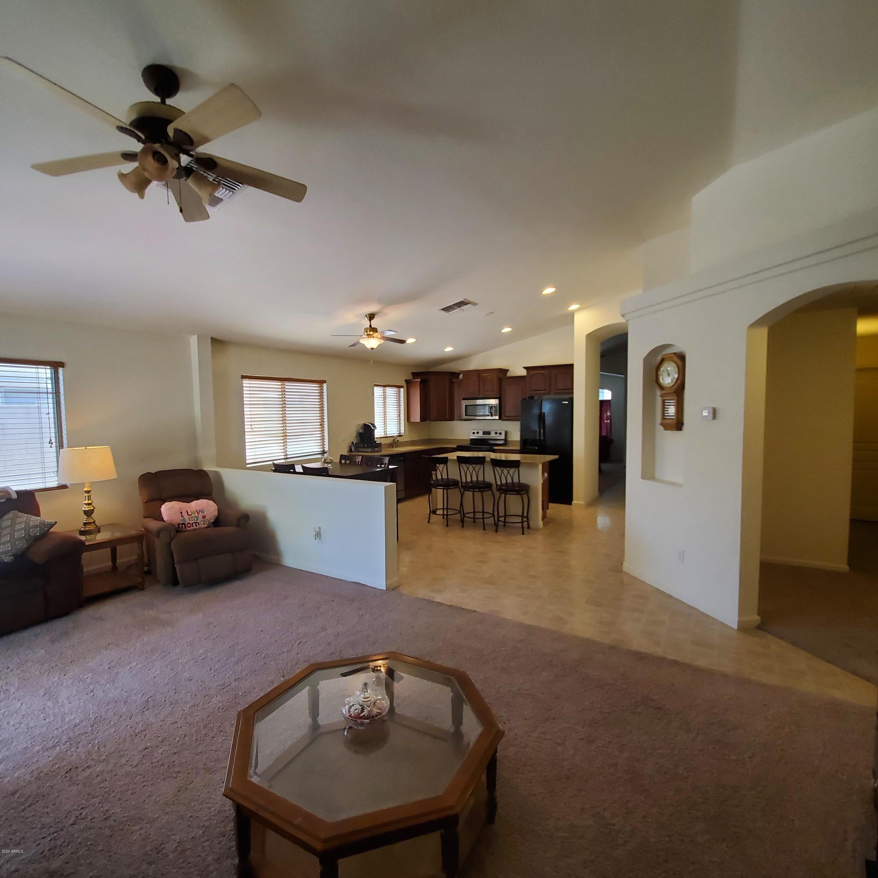 23740 West Pecan Road Buckeye, AZ 85326 - Photo 17 of 42 FAMILY ROOM TO KITCHEN