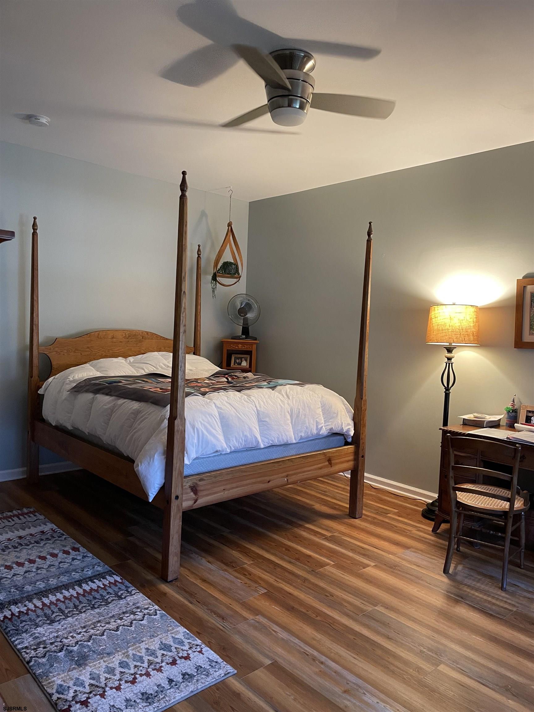 68 Ables Run Drive Absecon, NJ 08201 - Photo 15 of 28 a bedroom with a bed and wooden floor