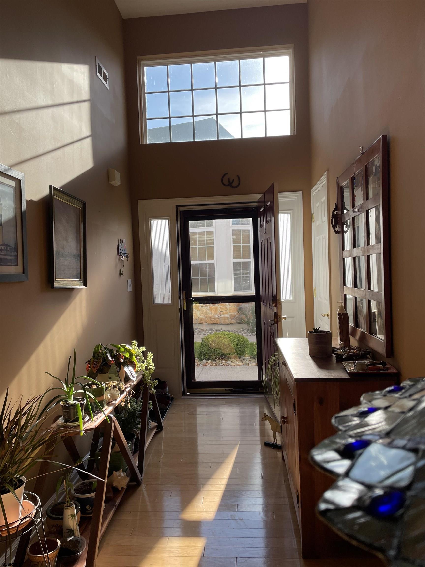 68 Ables Run Drive Absecon, NJ 08201 - Photo 2 of 28 a living room with furniture and a potted plant