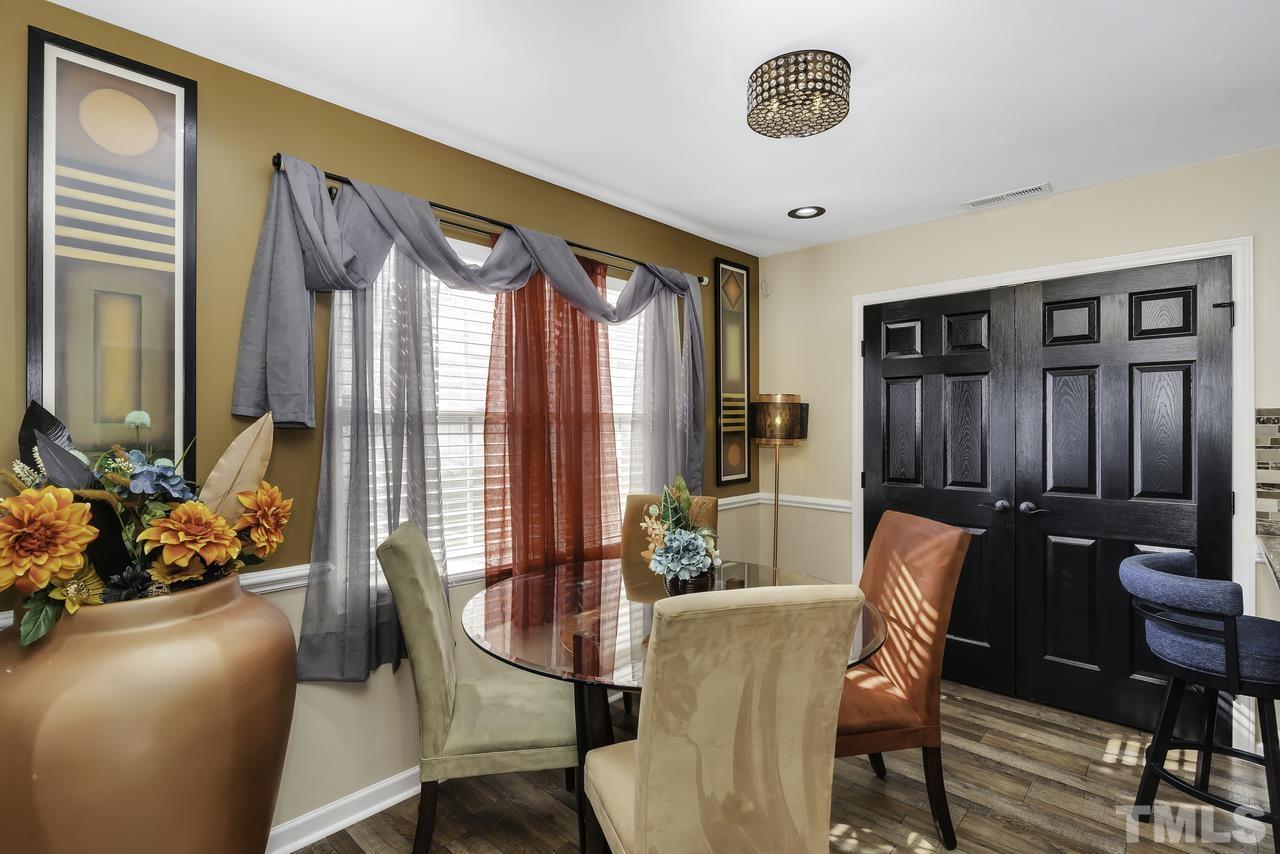 4704 Jelynn Street Raleigh, NC 27616 - Photo 11 of 30 a view of a dining room with furniture and window