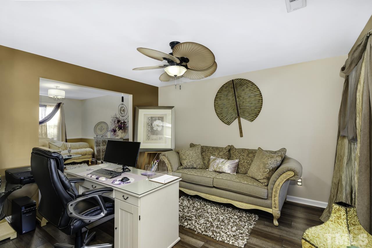 4704 Jelynn Street Raleigh, NC 27616 - Photo 4 of 30 a workspace with furniture and a window