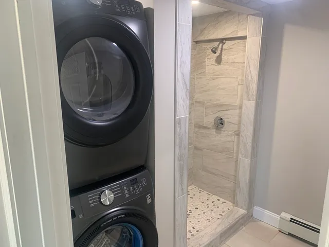 a white toilet sitting next to a bathroom sink