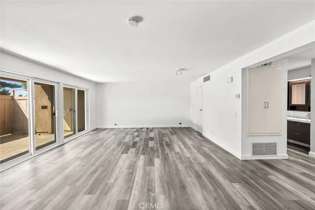 a view of a livingroom with wooden floor