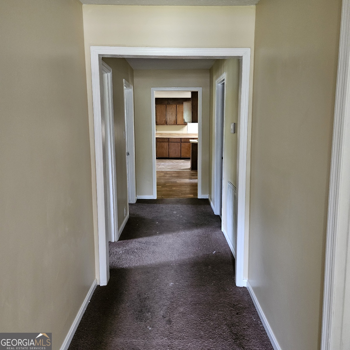 7067 Moseley Road Fort Valley, GA 31030 - Photo 19 of 37 a view of a hallway with a wooden cabinet