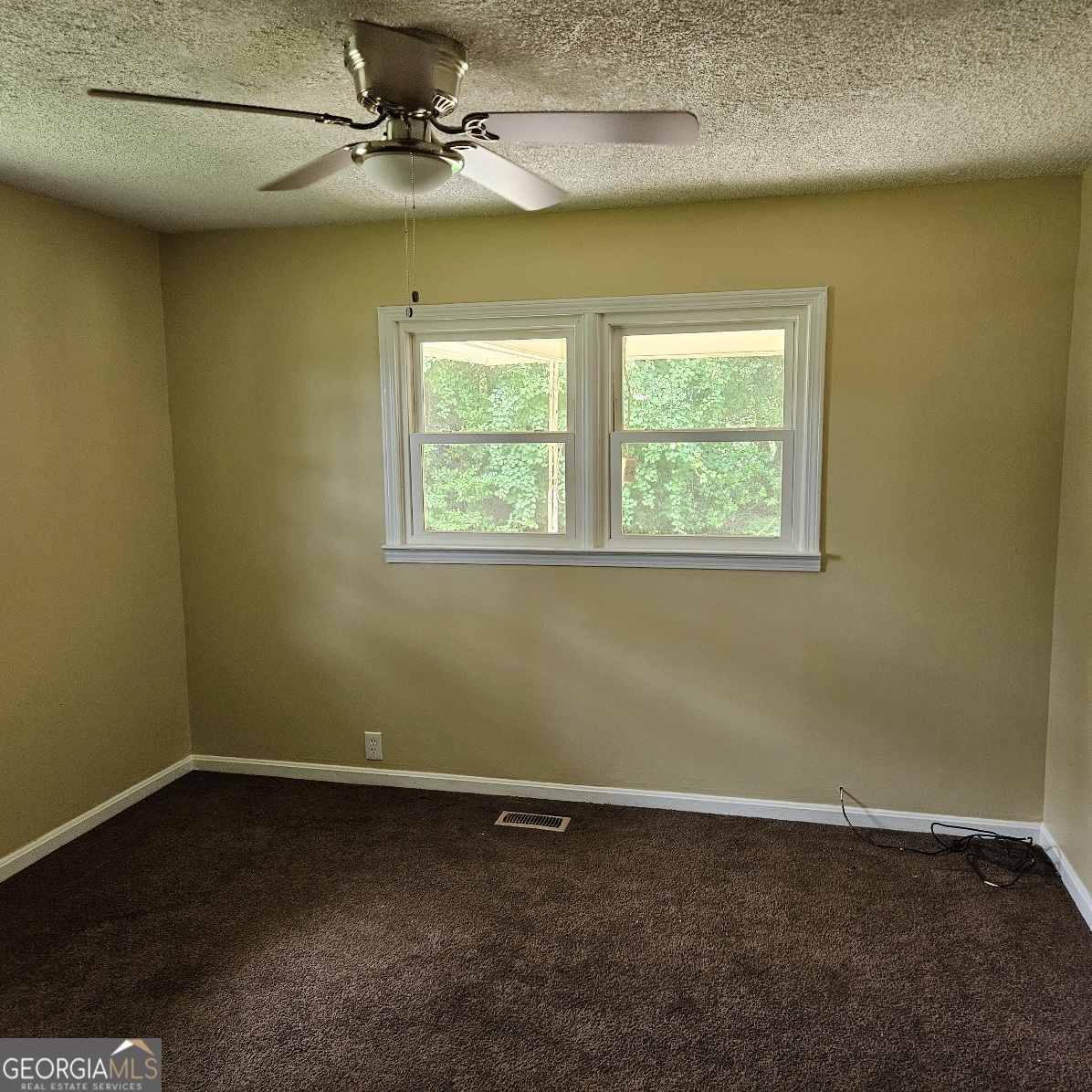 7067 Moseley Road Fort Valley, GA 31030 - Photo 33 of 37 an empty room with a window