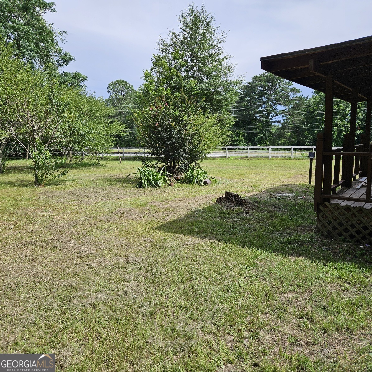 7067 Moseley Road Fort Valley, GA 31030 - Photo 36 of 37 a view of a green field with wooden fence