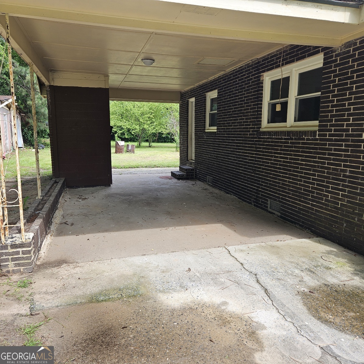 7067 Moseley Road Fort Valley, GA 31030 - Photo 4 of 37 a view of backyard with large tree