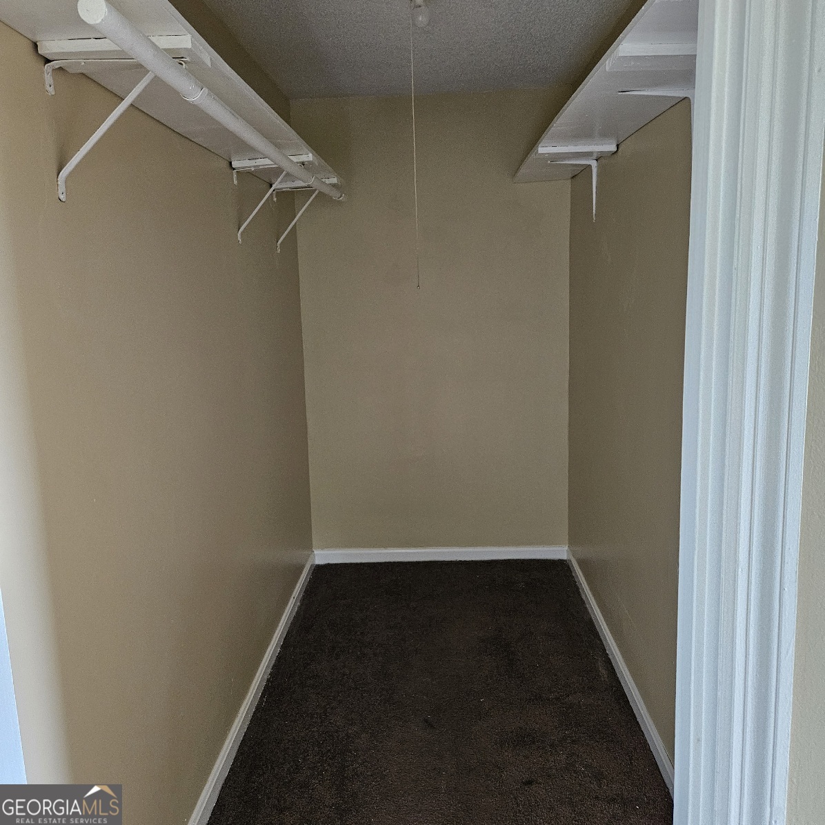 7067 Moseley Road Fort Valley, GA 31030 - Photo 6 of 37 a view of a room with racks on the wall