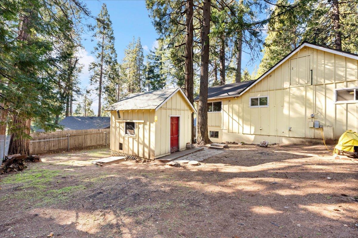 6780 Ridgeway Drive Pollock Pines, CA 95726 - Photo 15 of 27 a view of a house with a yard