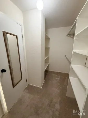 a bedroom with bed and window