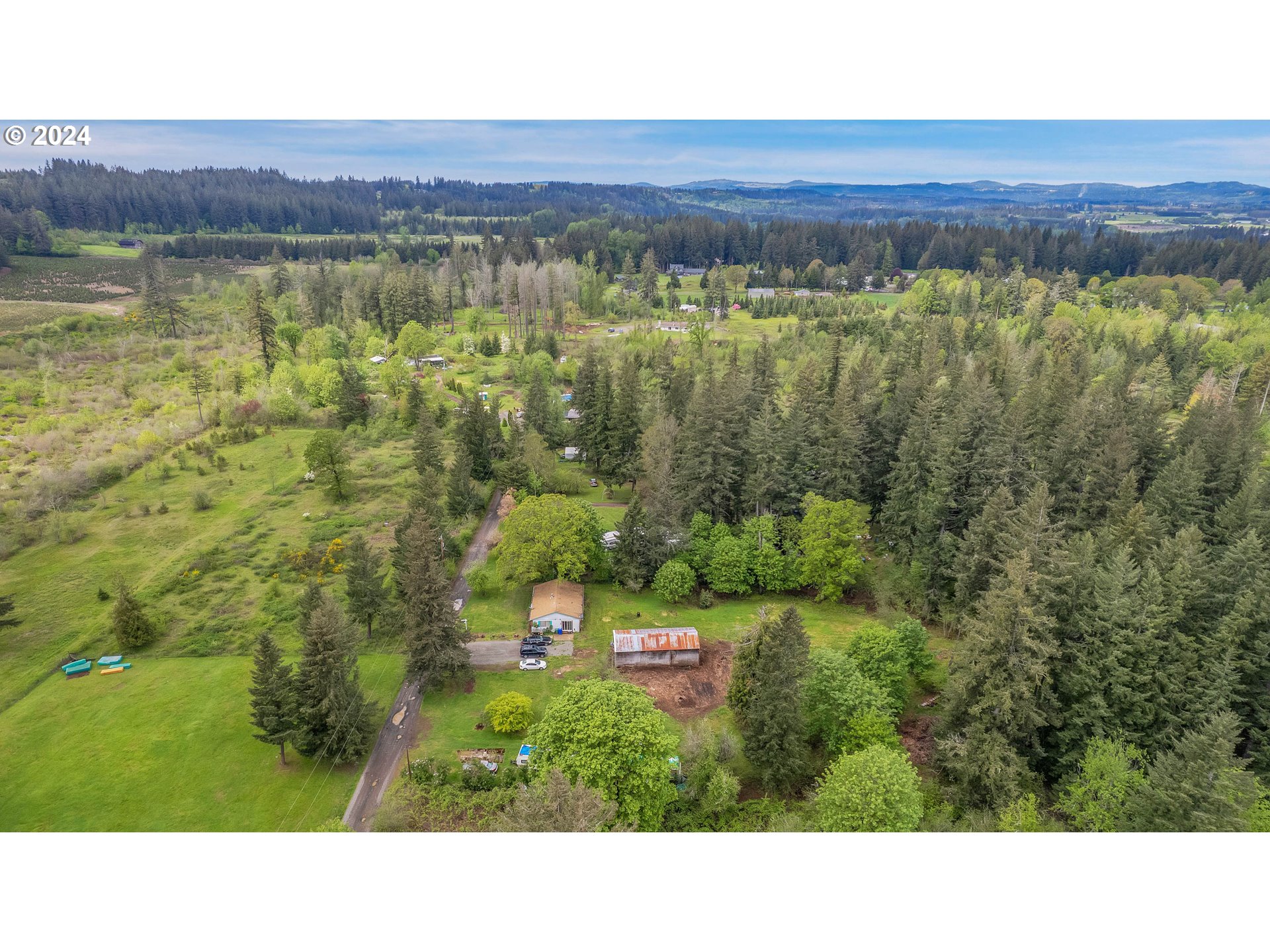 22370 South Bartholomew Road Estacada, OR 97023 - Photo 16 of 24 a black and white photo of a green yard